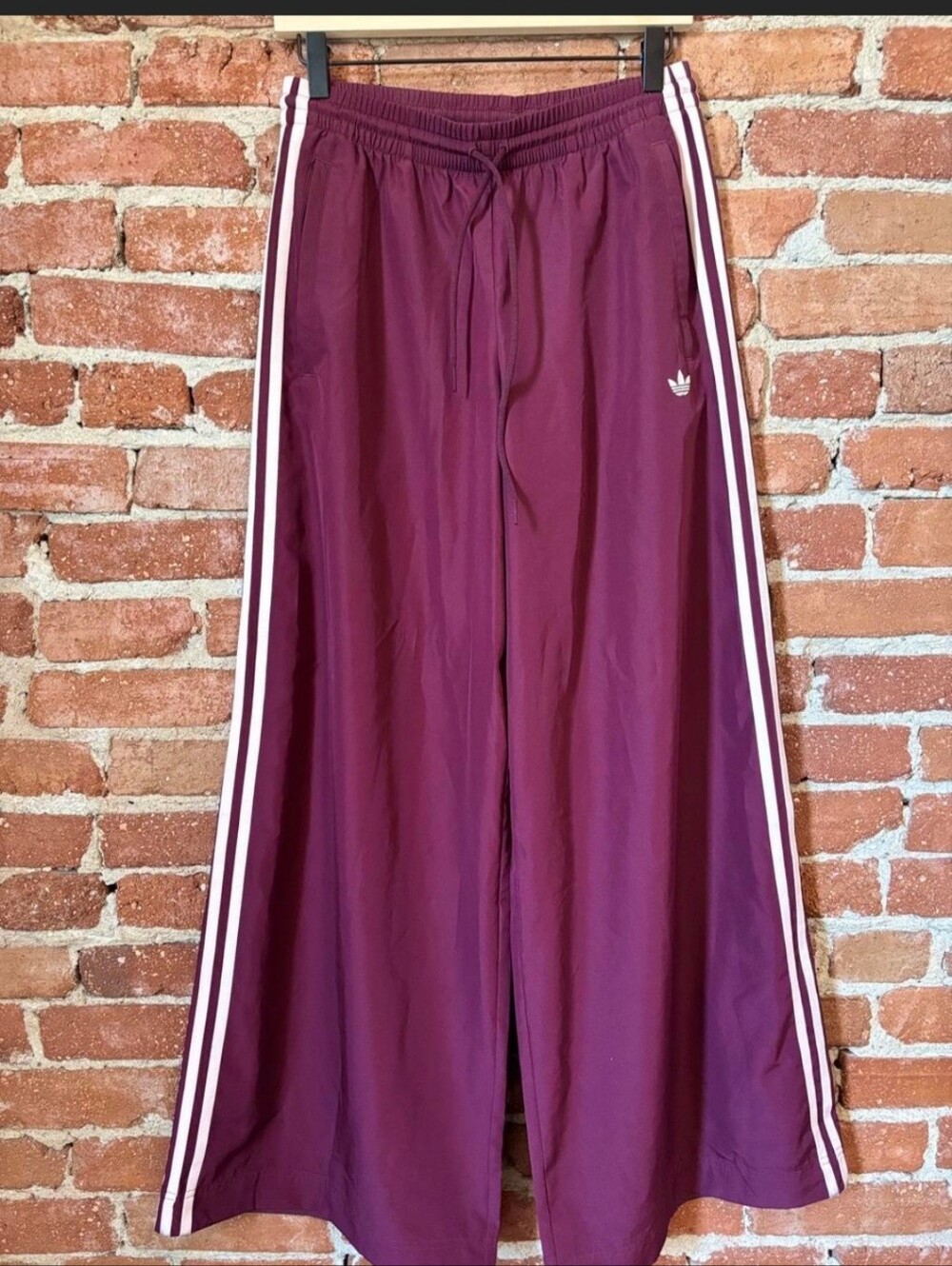 Adidas Adilenium 5.0 pleated track pants feature a wide-leg.